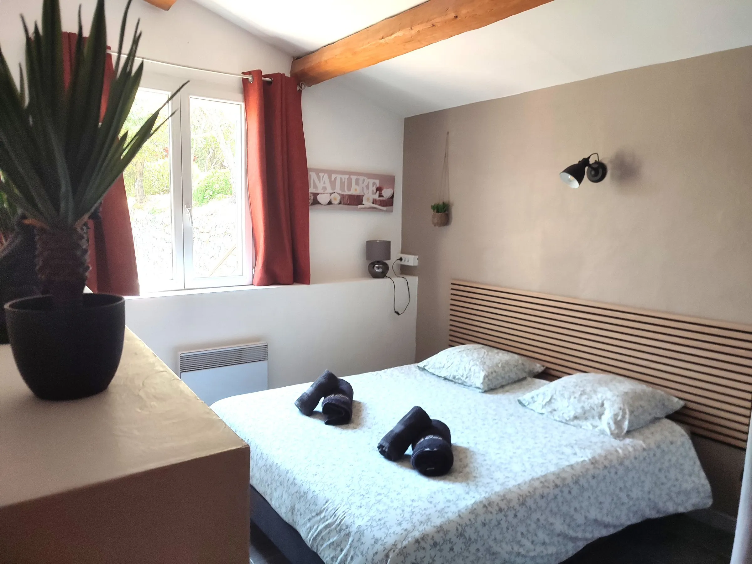 Bright double bedroom in natural tones