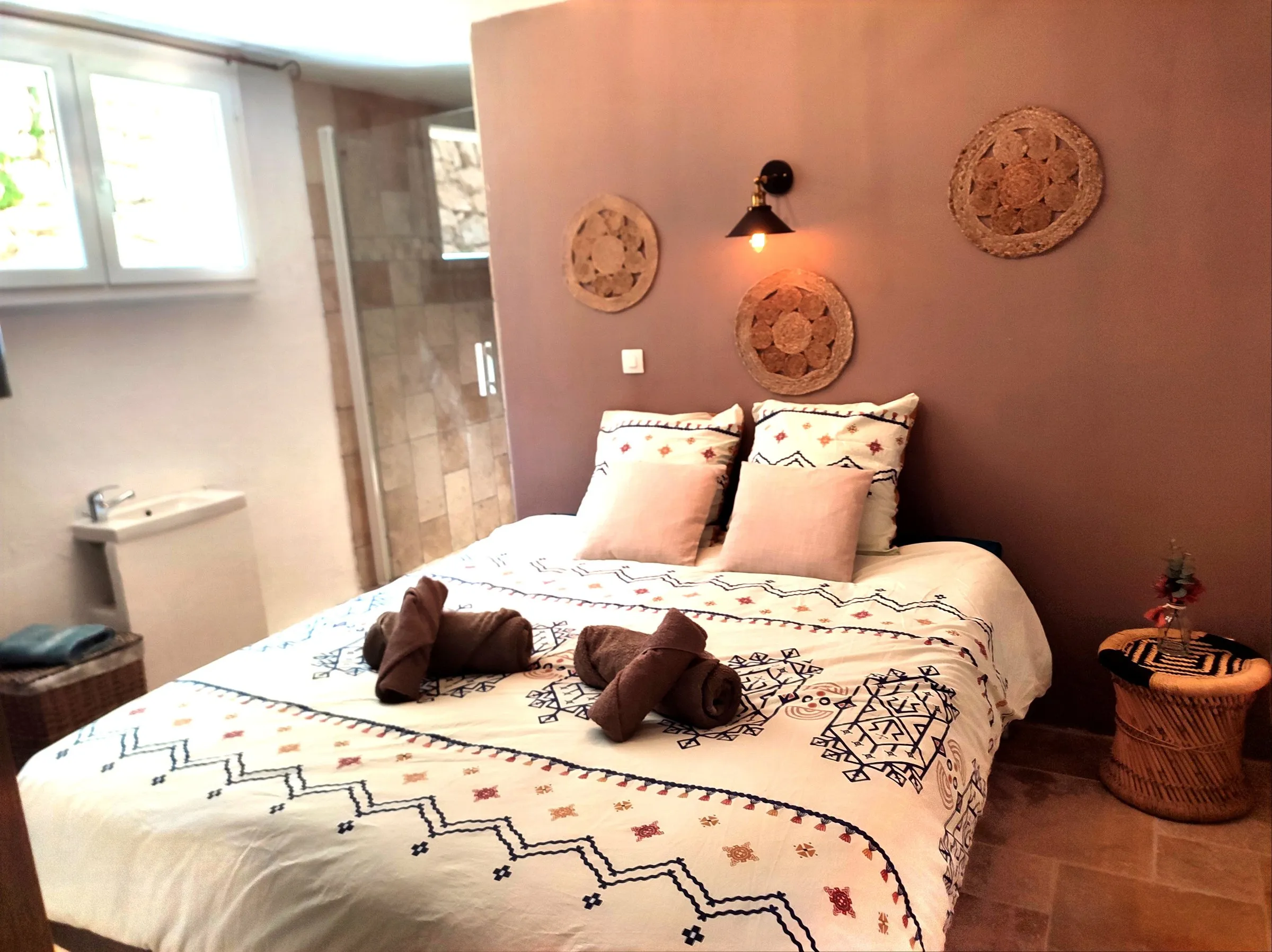 Bedroom in soft tones with a large window