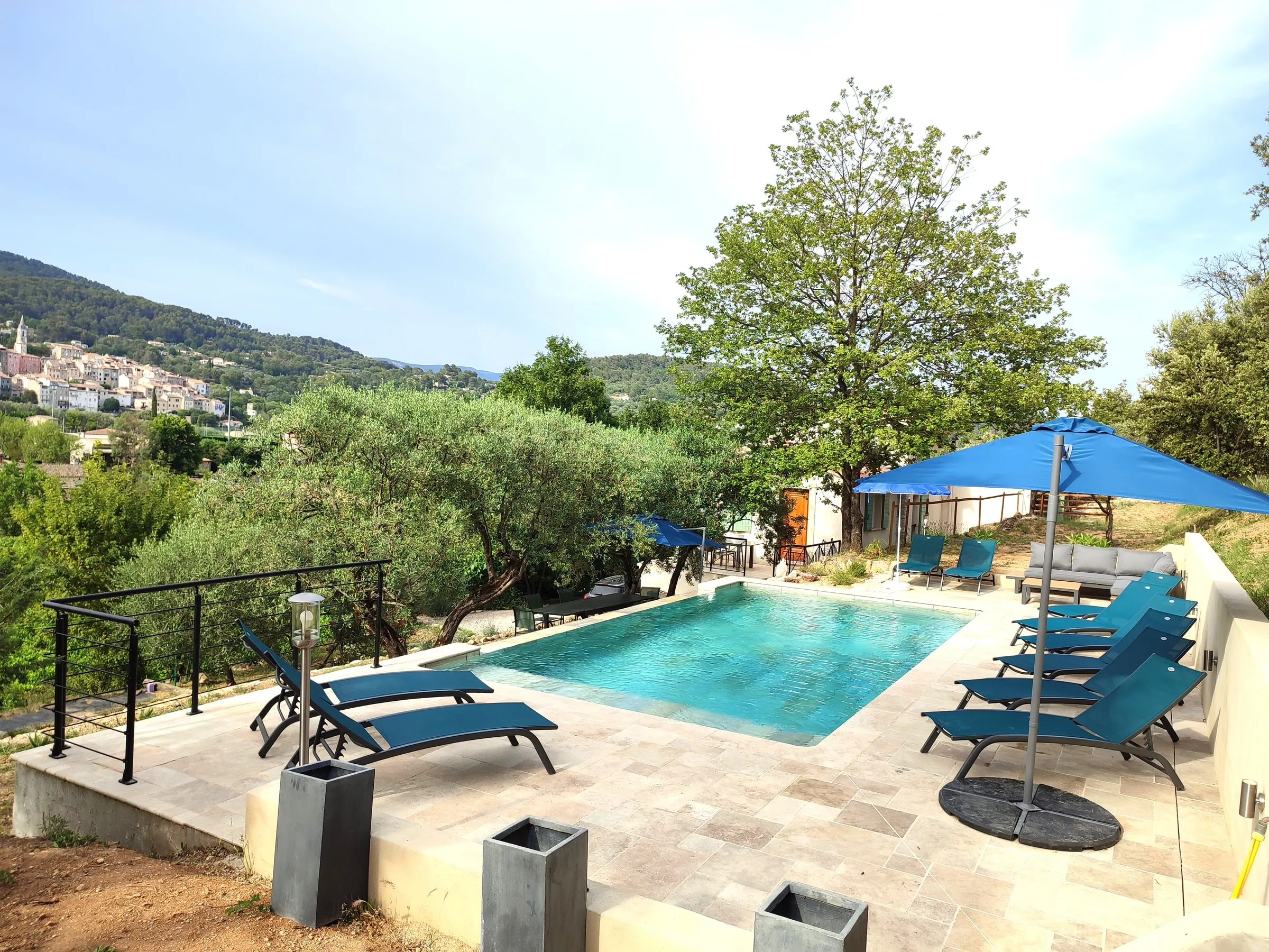 Sun loungers beside the estate pool